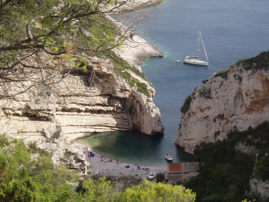 Swim in the sheltered waters of Stiniva Beach in Vis