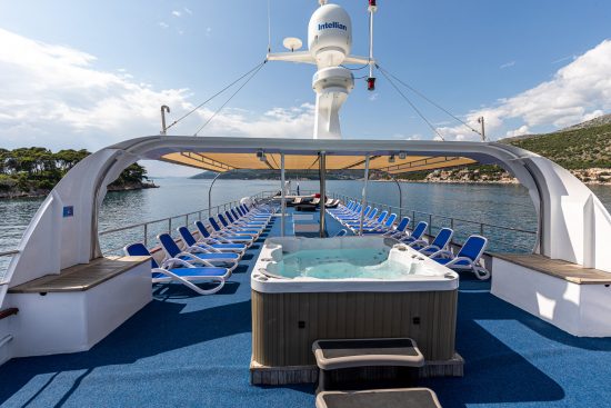 MS Princess Aloha sun deck with jacuzzi and deck chairs.