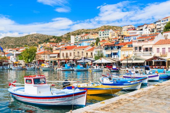 Traditional colourful Greek fishing boats in Pythagorion port, Samos Island.